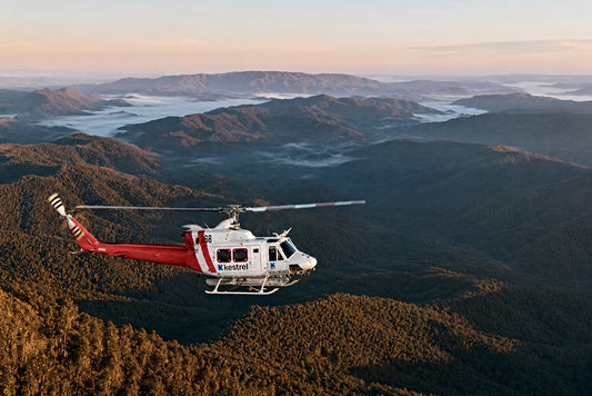 Bell 212 helicopter over Victorian high country