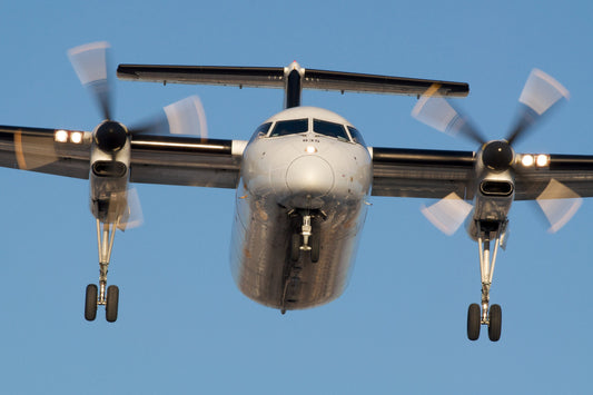 PNG Air Dash 9 coming into land