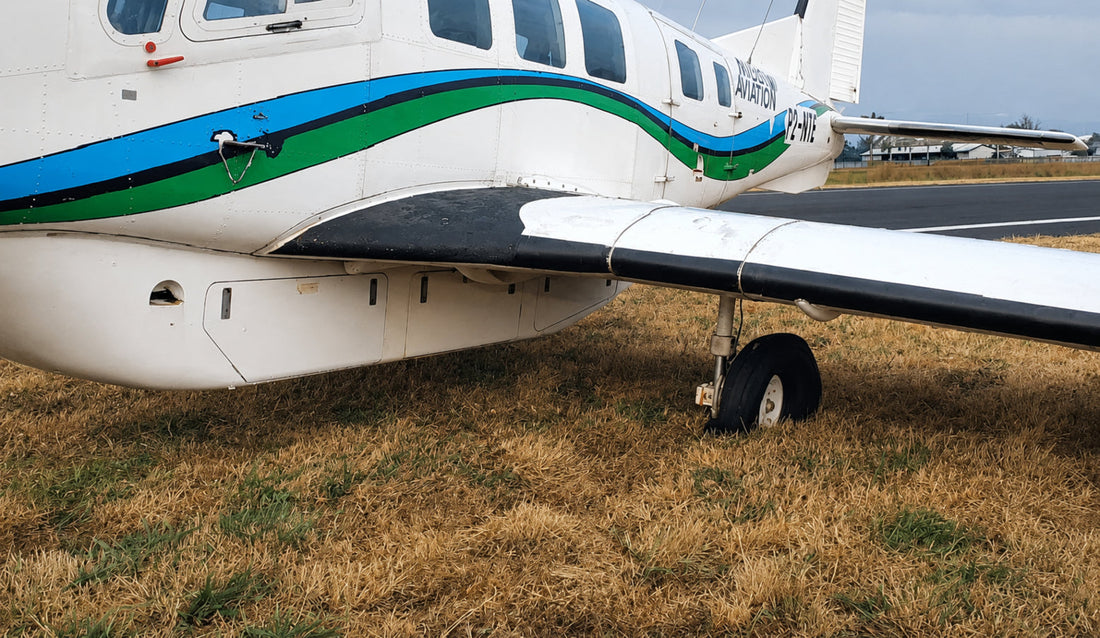 Niugini Aviation P-750 XSTOL with a burst tyre at Goroka Airport