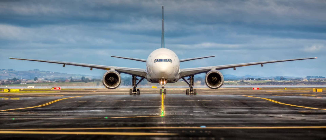 Twin jet aircraft at far end of a runway about to take off